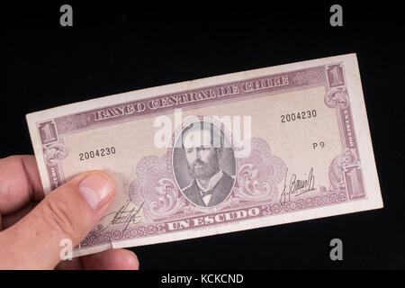 An old Chilean banknote on hand Stock Photo
