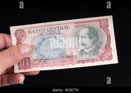 An old Chilean banknote on hand Stock Photo