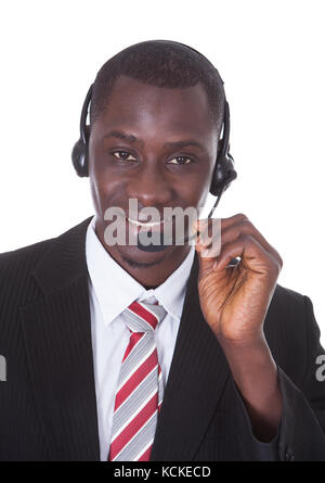 Young African Businessman Wearing Headset Isolated Over White Background Stock Photo