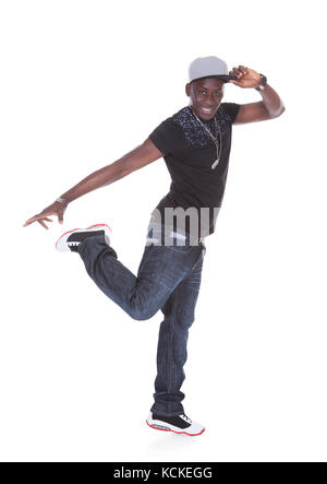 Happy African Young Man Dancing Over White Background Stock Photo