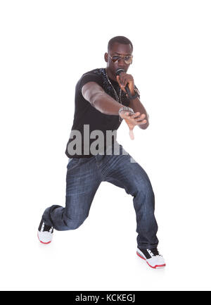 Portrait Of Young African Man Singing On White Background Stock Photo