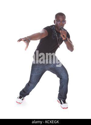 Portrait Of Young African Man Singing On White Background Stock Photo
