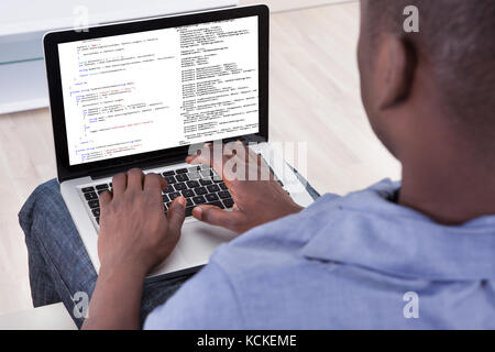 Close-up Of Person Typing On Laptop At Home Stock Photo
