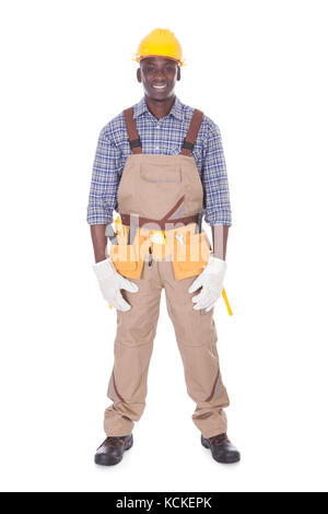 Portrait Of Happy Repairman Standing Over White Background Stock Photo