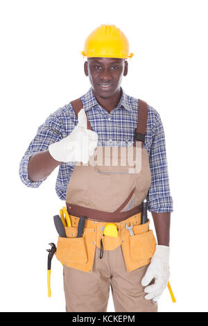Portrait Of Happy Repairman Standing Over White Background Stock Photo