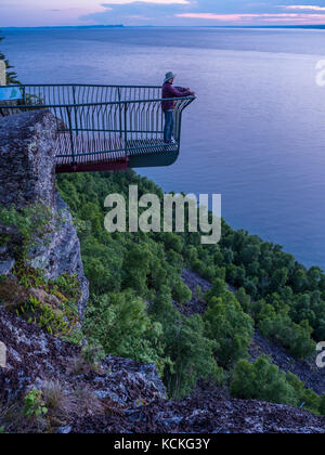 Woman at Thunder Bay Lookout, Sleeping Giant Provincial Park, Ontario, Canada.