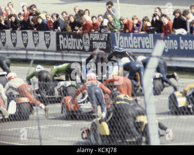 Motorsport Crowd Scenes 1978 to 1986 Scanned from 35mm full and 1/2 frame originals. Hence some noise and scratches. Batch of 33 images. Brands Hatch, Hampshire and Brighton. Edited for clothing, fashion, body image etc. Quasi Historical, Social History Stock Photo