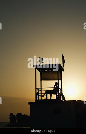 Anonymous person sitting in observation tower Stock Photo