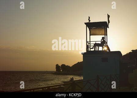 Anonymous person sitting in observation tower Stock Photo