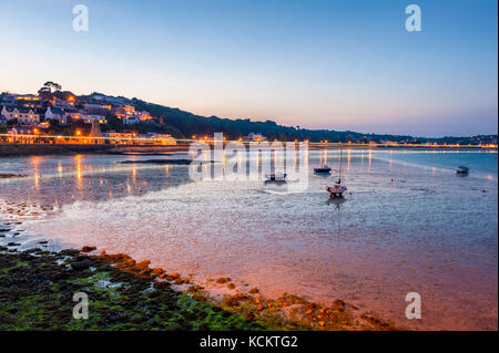 Coastline of Saint Aubin, Jersey, Channel Islands, UK at low tide and sunset Stock Photo