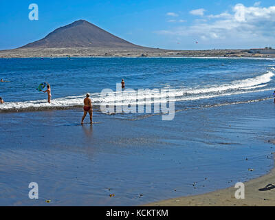 Bathers on El Medano Beach and Mount Montana Roja in the background, Tenerife, Canary Islands, Spain, Europe Stock Photo