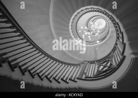 Black and white / monochrome image of Cecil Brewer's spiral staircase in Heals Department Store, Tottenham Court Road, London UK Stock Photo