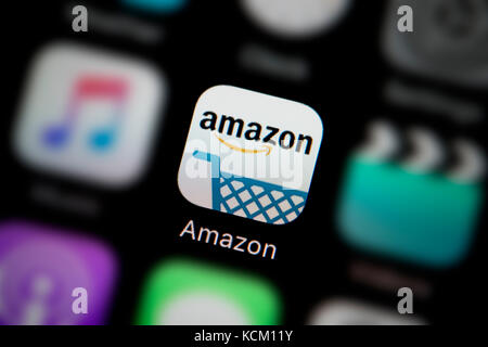 A close-up shot of the company logo representing the Amazon app icon, as seen on the screen of a smart phone (Editorial use only) Stock Photo