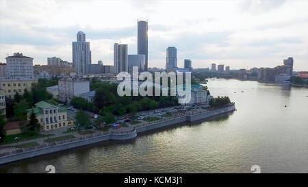 Aerial Yekaterinburg city center skyline and Iset river. Ekaterinburg is the fourth largest city in Russia and the centre of Sverdlovsk Oblast. Aerial view to the central part of Yekaterinburg, view from the sky. Stock Photo