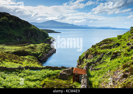 The hills of Trotternish on the Isle of Skye, Calum's Road above Loch Arnish, Isle of Raasay, Scotland, UK Stock Photo