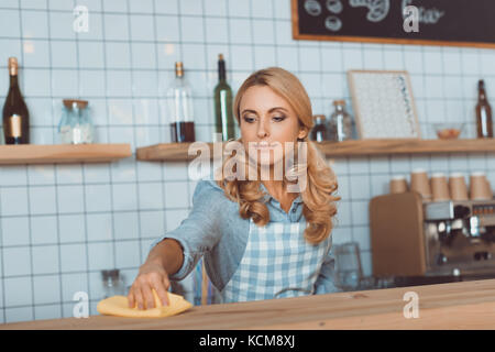waitress cleaning bar counter Stock Photo