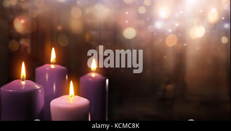 Advent Candles In Church - Three Purple And One Pink As A Catholic Symbol And Bokeh Lights Stock Photo