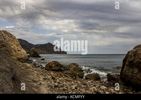 landscape of a famous rock formations, bays near the extinct volcano Karadag Mountain in KaraDag reserve in north-east Crimea, Black sea Stock Photo