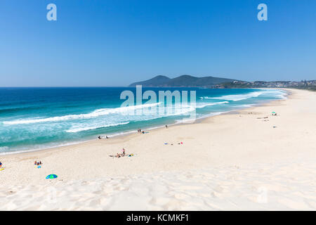 Beautiful Spring day at One mile Beach, near Forster on the New South Wales Coast, the beach is famous for its large hill sand dune,Australia Stock Photo