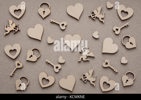 Wooden Silhouettes Of Hearts, Amurs, Castles, Keys On Paper Background For Design Artwork. Stock Photo