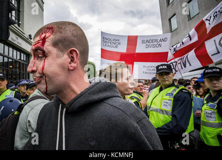 Hundreds of English Defence League (EDL) protesters prepare to march across Tower Bridge towards east London, UK. Stock Photo