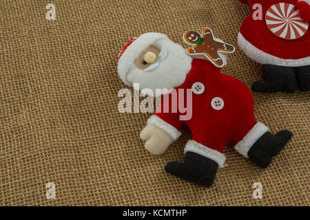 High angle view of stuffed santa claus on burlap Stock Photo