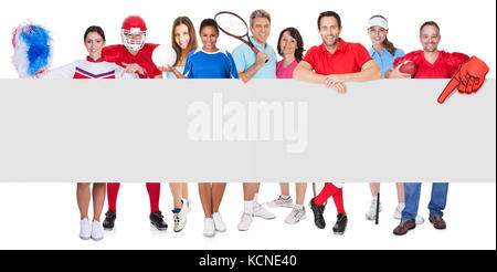 Group of sports people presenting empty banner. Isolated on white Stock Photo