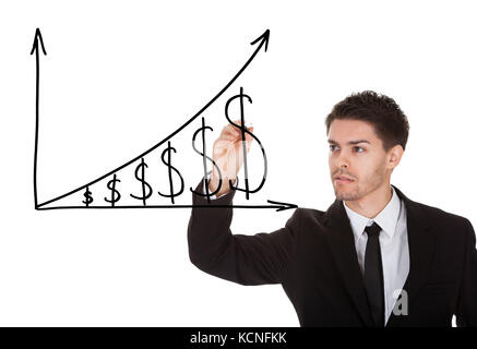 Man holding pen drawing dollar growth chart on white screen Stock Photo