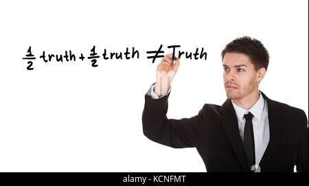 Half truth and half truth does not equal truth on white screen Stock Photo