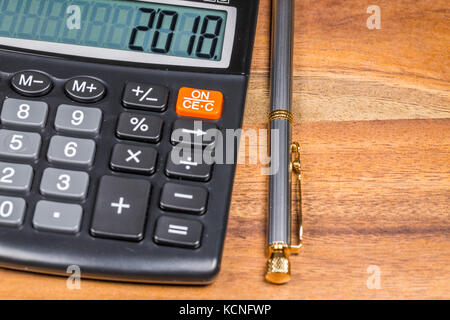 Electronic Calculator with 2018 number on display And Pen Stock Photo