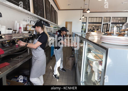 Santa Barbara, California, USA - September 19th, 2017: Two young women working as baristas at the Goat Tree Restaurant, Santa Barbara. Stock Photo