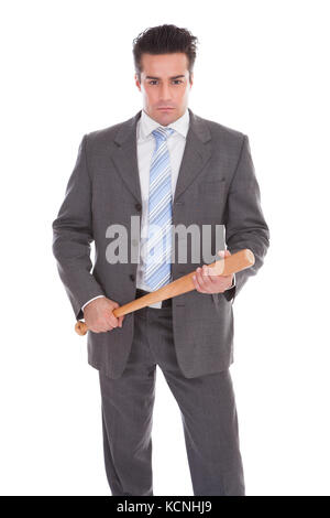 Portrait Of Young Businessman Holding Baseball Bat Over White Background Stock Photo