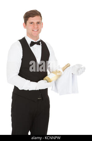 Waiter Holding A Champagne Bottle Isolated Over White Background Stock Photo