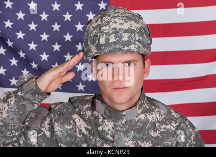 An American solider of the United States Army stands next to the sign ...