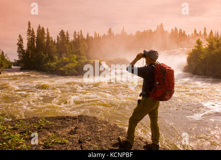hiker at  Pisew Falls Provincial Park along the Grass River, Manitoba, Canada Stock Photo