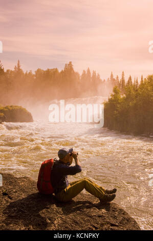 hiker at  Pisew Falls Provincial Park along the Grass River, Northern Manitoba, Canada Stock Photo