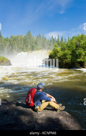 hiker at  Pisew Falls Provincial Park along the Grass River, Northern Manitoba, Canada Stock Photo