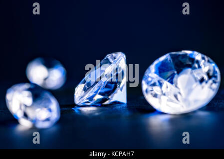 Four brilliants as close up in blue light Stock Photo
