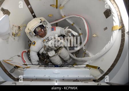 International Space Station Expedition 53 crew member Mark Vande Hei prepares for his spacewalk to install a new latching end effector on the tip of the Canadarm2 robotic arm October 6, 2017 in Earth Orbit. Credit: Planetpix/Alamy Live News Stock Photo