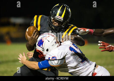 Florida, USA. 6th Oct, 2017. LOREN ELLIOTT | Times .Lakewood running back Cornell Battles is tackled by Pinellas Park linebacker Christian Syms during the first half of a game between Pinellas Park and Lakewood at Lakewood High in St. Petersburg, Fla., on Friday, Oct. 6, 2017. Credit: Loren Elliott/Tampa Bay Times/ZUMA Wire/Alamy Live News Stock Photo