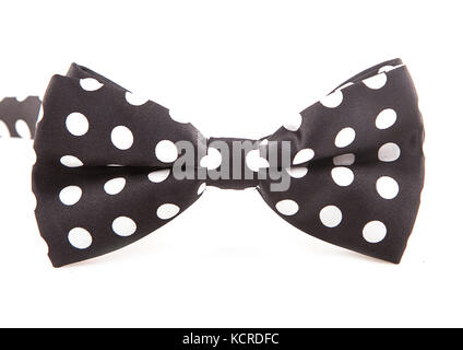 black bow with white big bright peas on a white background.Men's accessories. Stock Photo