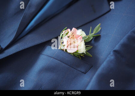 Man In Blue Suit With Black Bow Tie Flower Brooch Stock Photo - Download  Image Now - Adjusting, Adult, Arts Culture and Entertainment - iStock