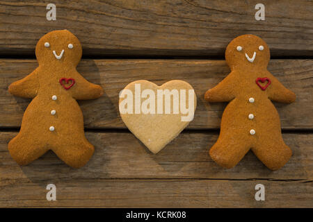 Overhead view of gingerbread cookies on wooden table Stock Photo