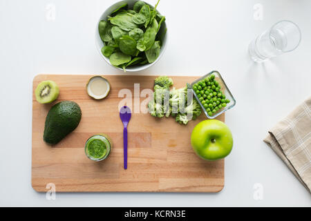vegetable puree or baby food and fruits on board Stock Photo