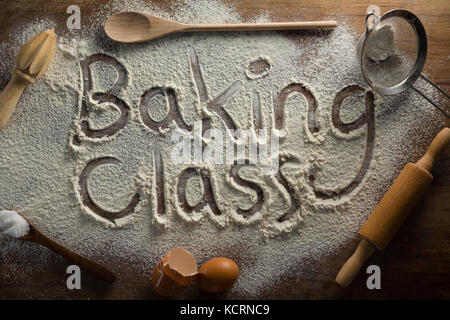 Over head view of the word baking class written on sprinkled flour Stock Photo