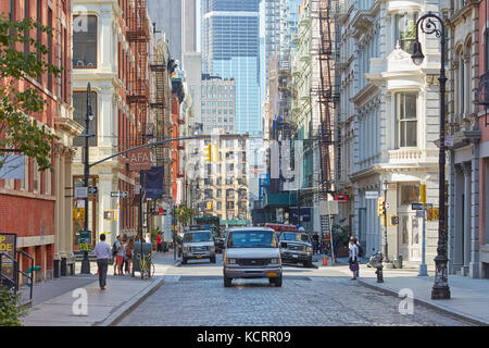 Soho street with cast iron buildings and people in a sunny day in New York Stock Photo