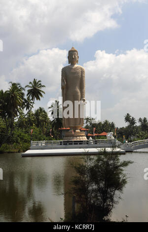 Peraliya Hikkaduwa Sri Lanka Tsunami Honganji Vihara Memorial to the Victims Of the 2004 Tsunami - Large Standing Buddha Statue Right Hand in the Vita Stock Photo