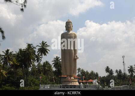 Peraliya Hikkaduwa Sri Lanka Tsunami Honganji Vihara Memorial to the Victims Of the 2004 Tsunami - Large Standing Buddha Statue Right Hand in the Vita Stock Photo