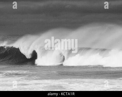 Hurricane generated waves off the New Jersey coast near Lavallette, NJ with powerful wind blowing wavetops off. Seascape in black and white. Stock Photo