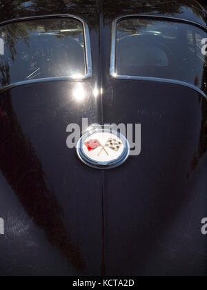 1963 Corvette split-window coupe at car show with sun glistening off chrome trim. Stock Photo